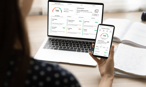A laptop and mobile phone displays a person's credit score - free to Quorum members.