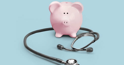 Piggy bank with doctor's stethoscope around it, illustrating a financial checkup.
